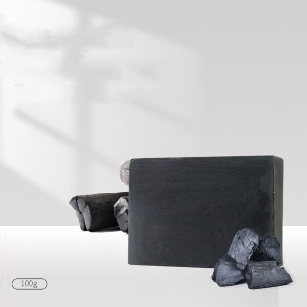 Charcoal soap bar with natural charcoal pieces, ideal for detoxifying and deep cleansing skincare routines